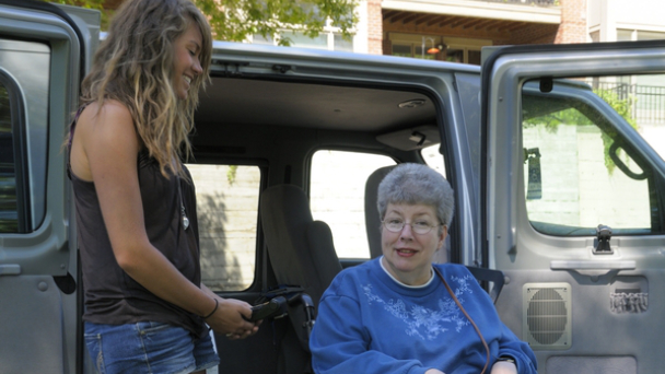 woman assisting senior woman